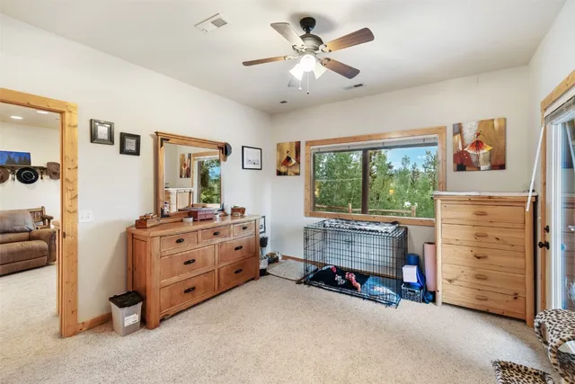 a room with furniture and a dresser