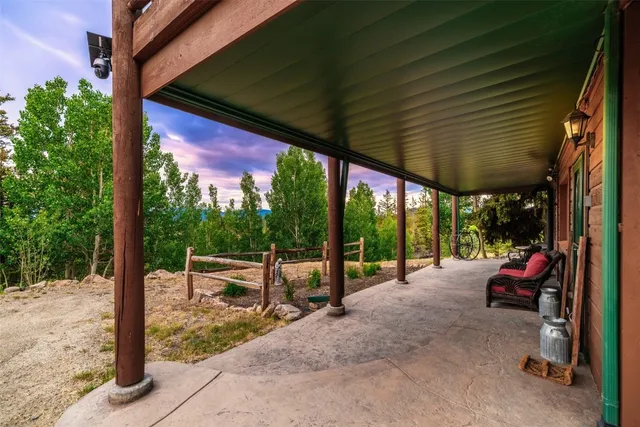 a view of balcony with wooden floor and outdoor seating
