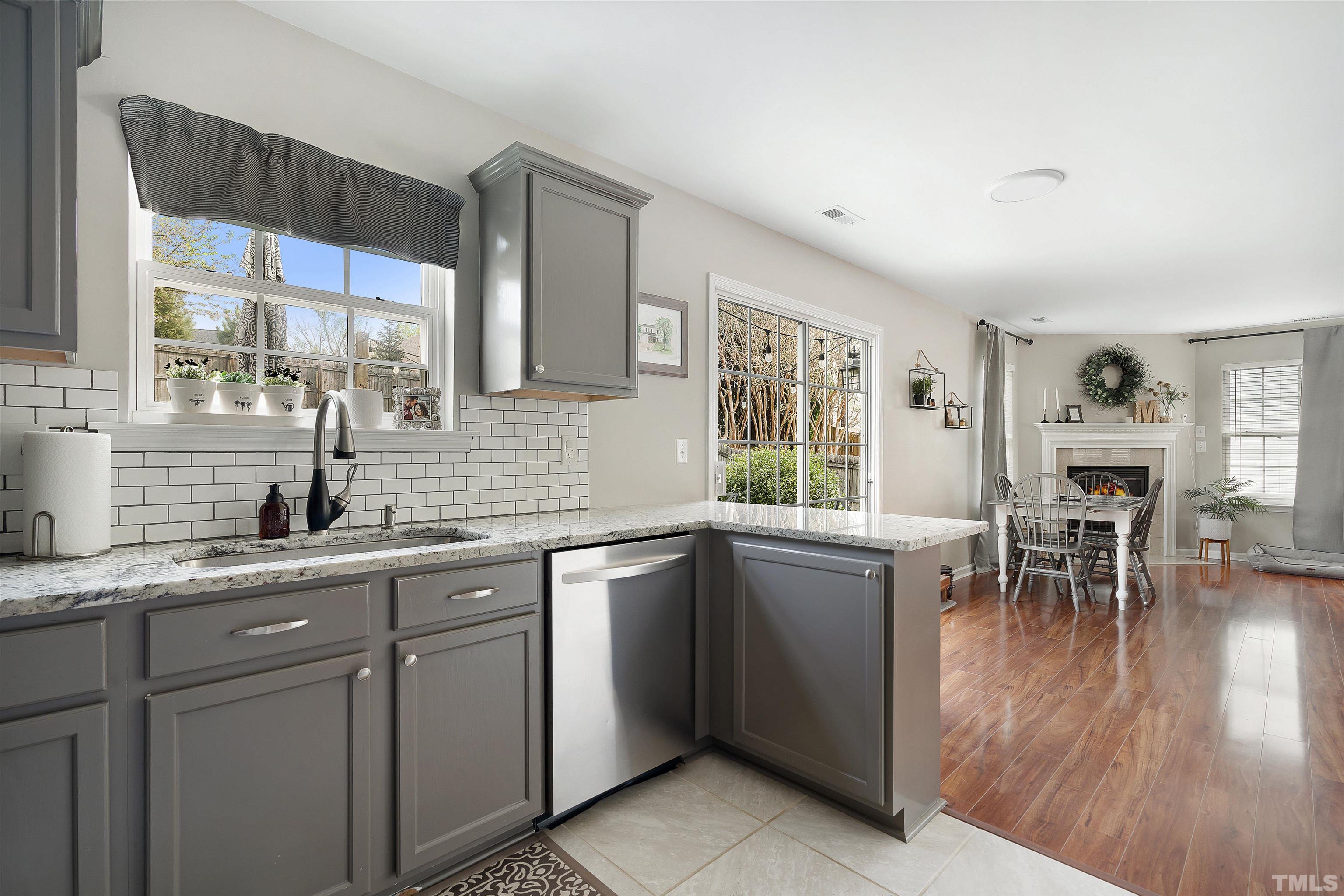 12440 North Exeter Way Durham, NC 27703 - Photo 12 of 36 a kitchen with a sink and cabinets