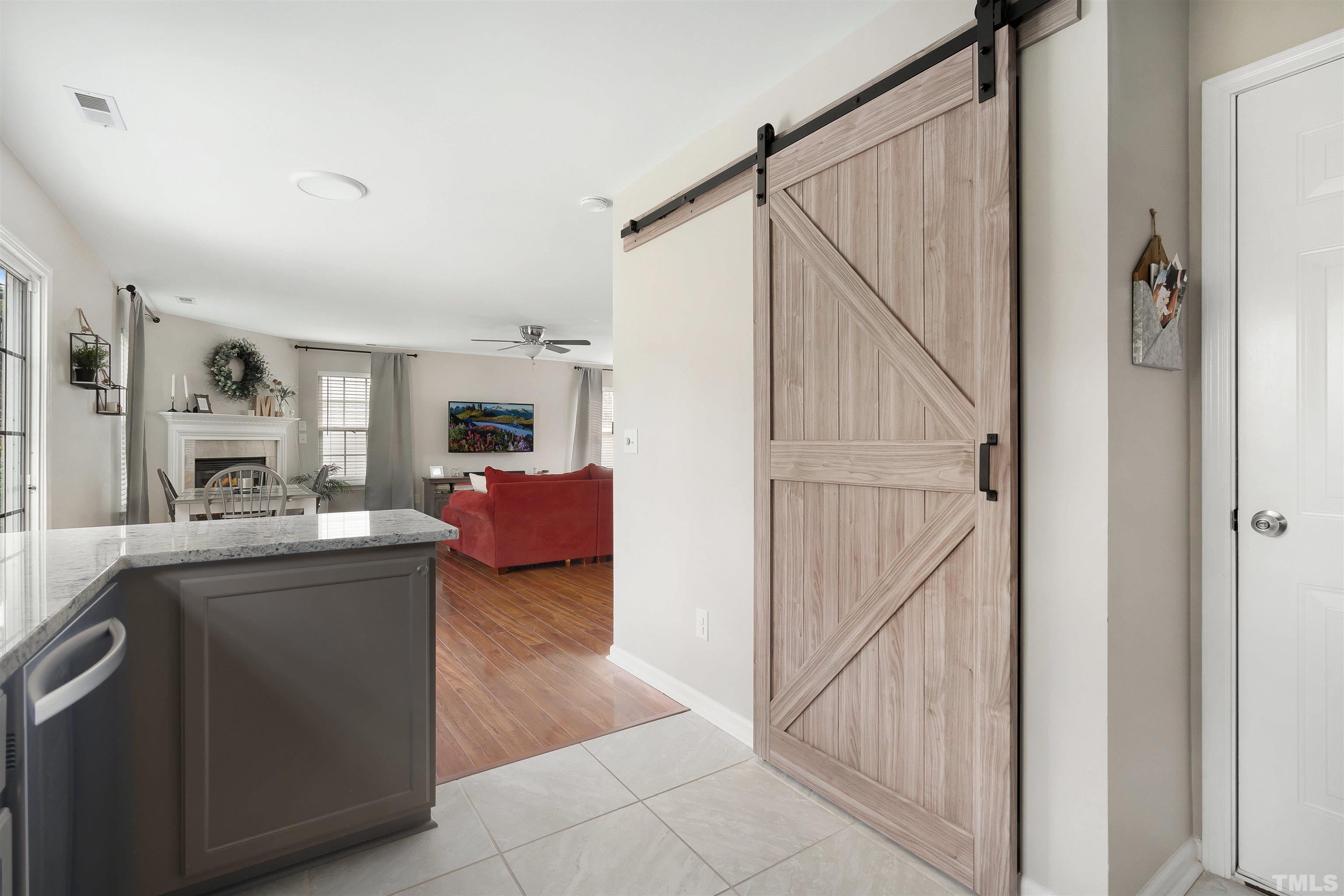 12440 North Exeter Way Durham, NC 27703 - Photo 13 of 36 a living room with stainless steel appliances furniture and a kitchen view