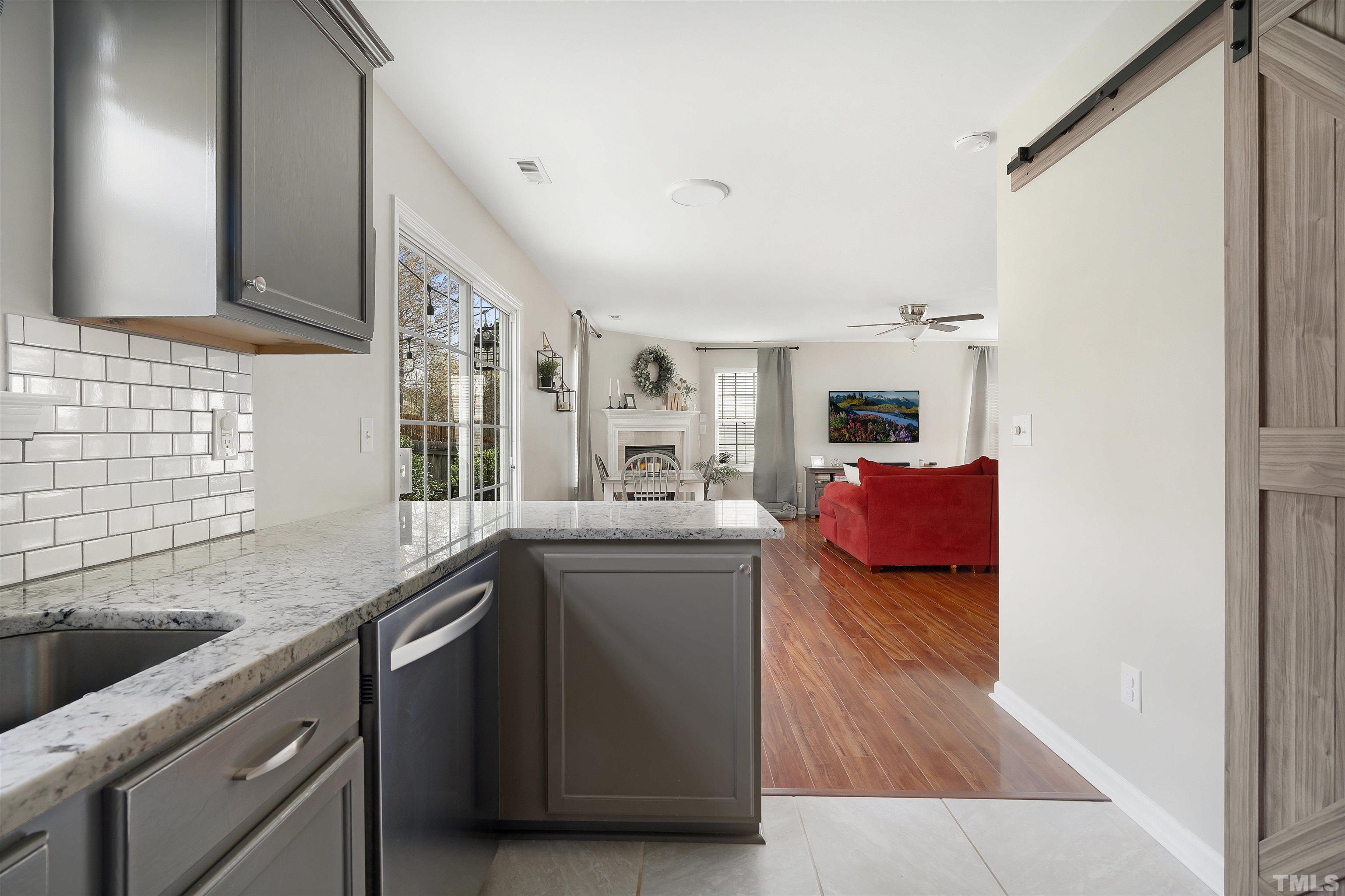 12440 North Exeter Way Durham, NC 27703 - Photo 14 of 36 a kitchen with sink cabinets and stove