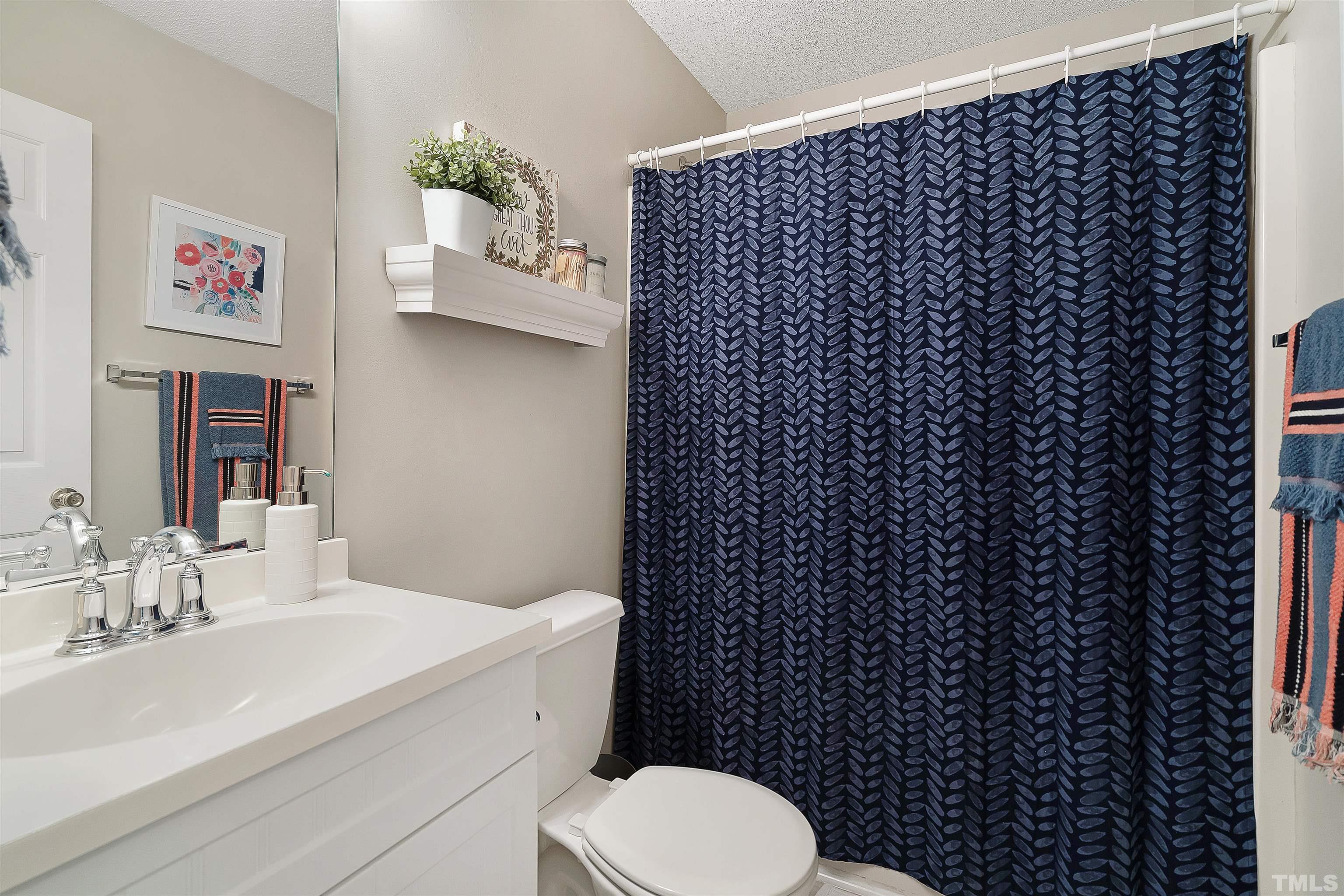 12440 North Exeter Way Durham, NC 27703 - Photo 25 of 36 a bathroom with a sink toilet and vanity
