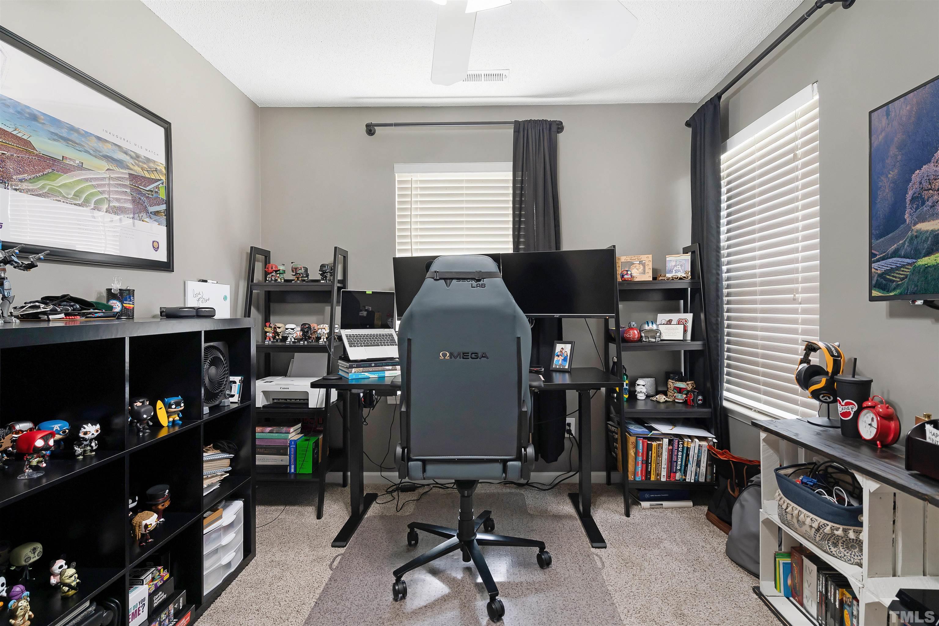 12440 North Exeter Way Durham, NC 27703 - Photo 27 of 36 a room with furniture and a window