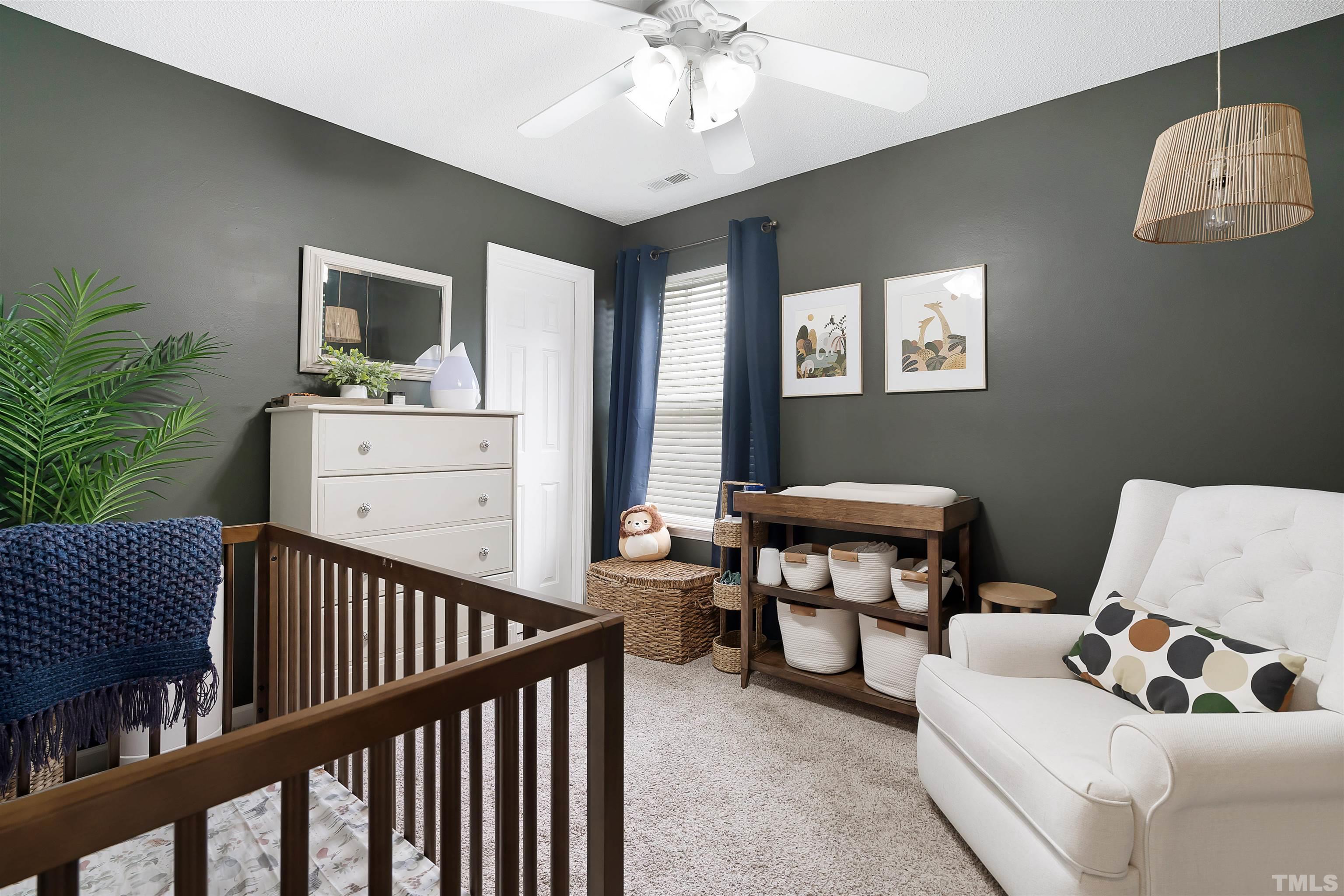 12440 North Exeter Way Durham, NC 27703 - Photo 31 of 36 a bedroom with furniture and a window
