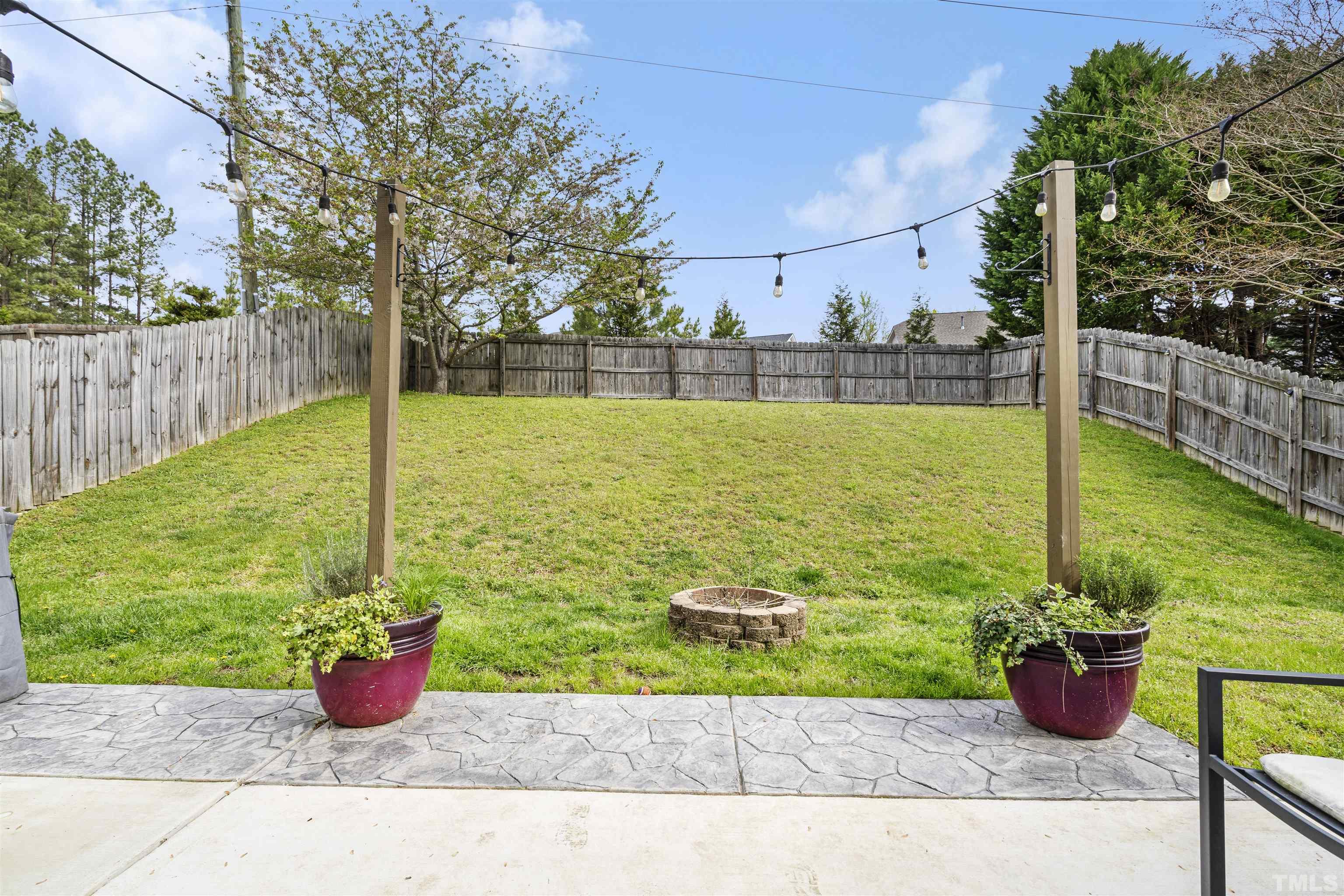 12440 North Exeter Way Durham, NC 27703 - Photo 34 of 36 a view of a backyard with potted plants