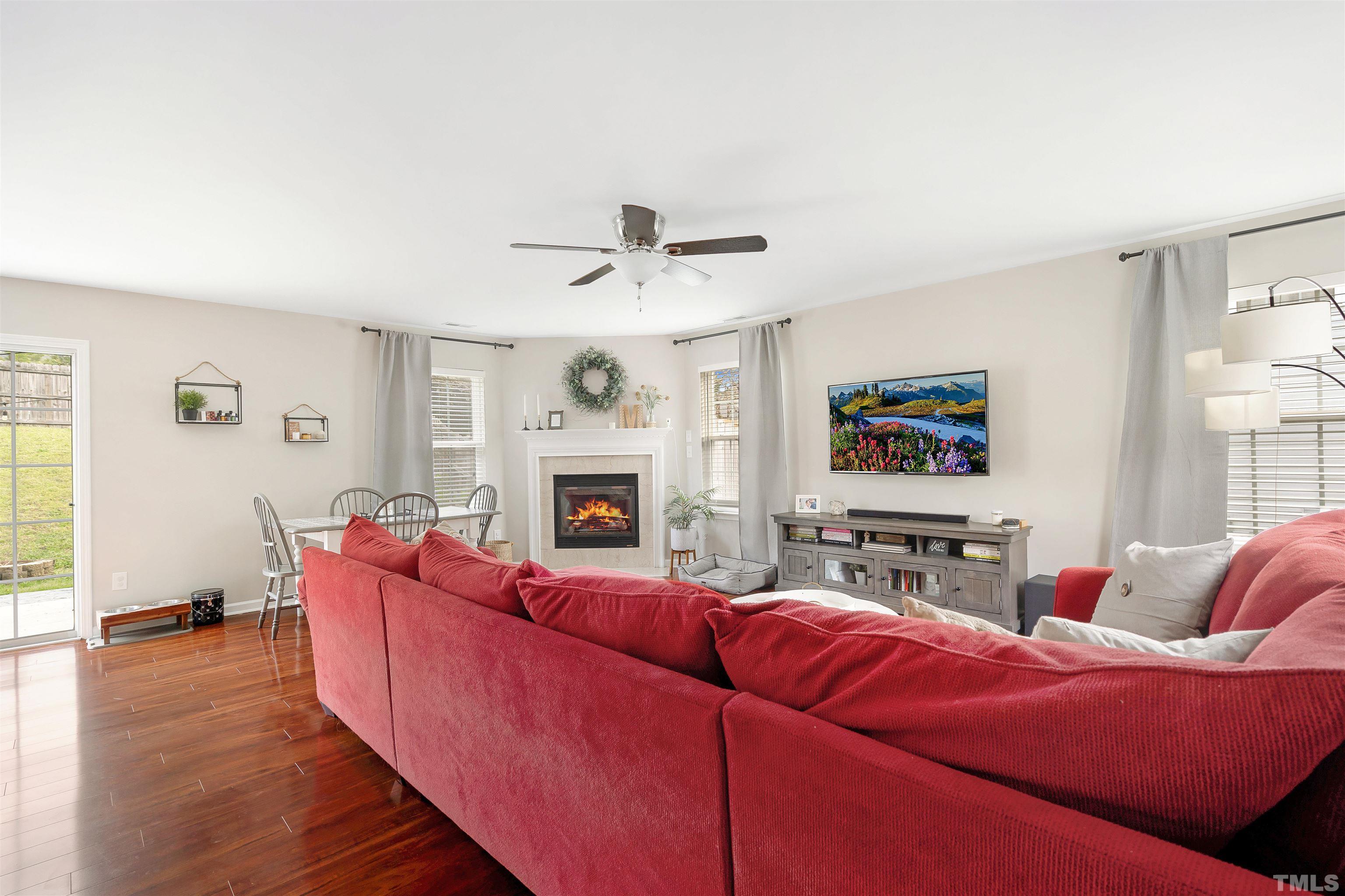 12440 North Exeter Way Durham, NC 27703 - Photo 5 of 36 a living room with furniture and a fireplace