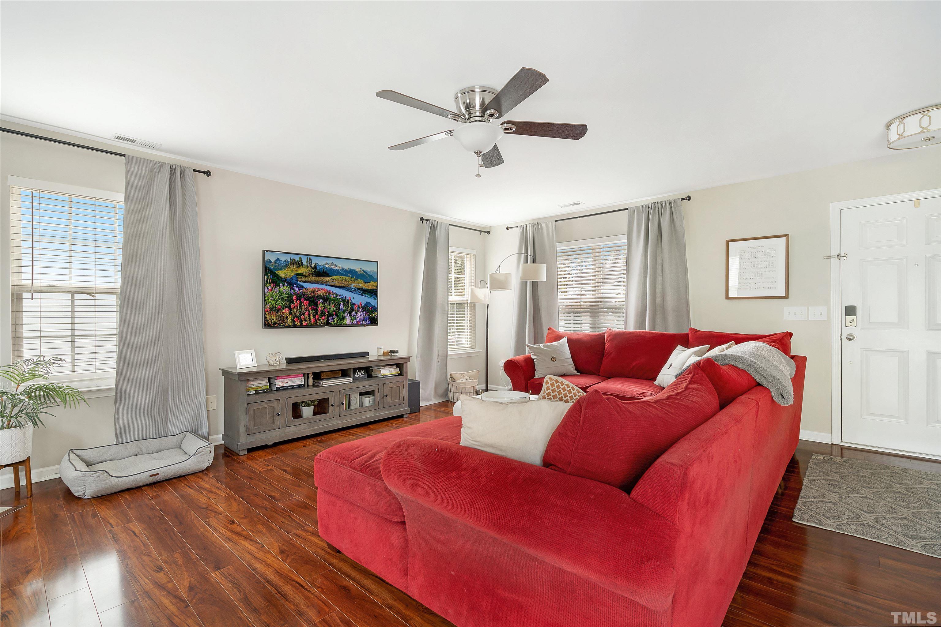 12440 North Exeter Way Durham, NC 27703 - Photo 6 of 36 a living room with furniture and a flat screen tv