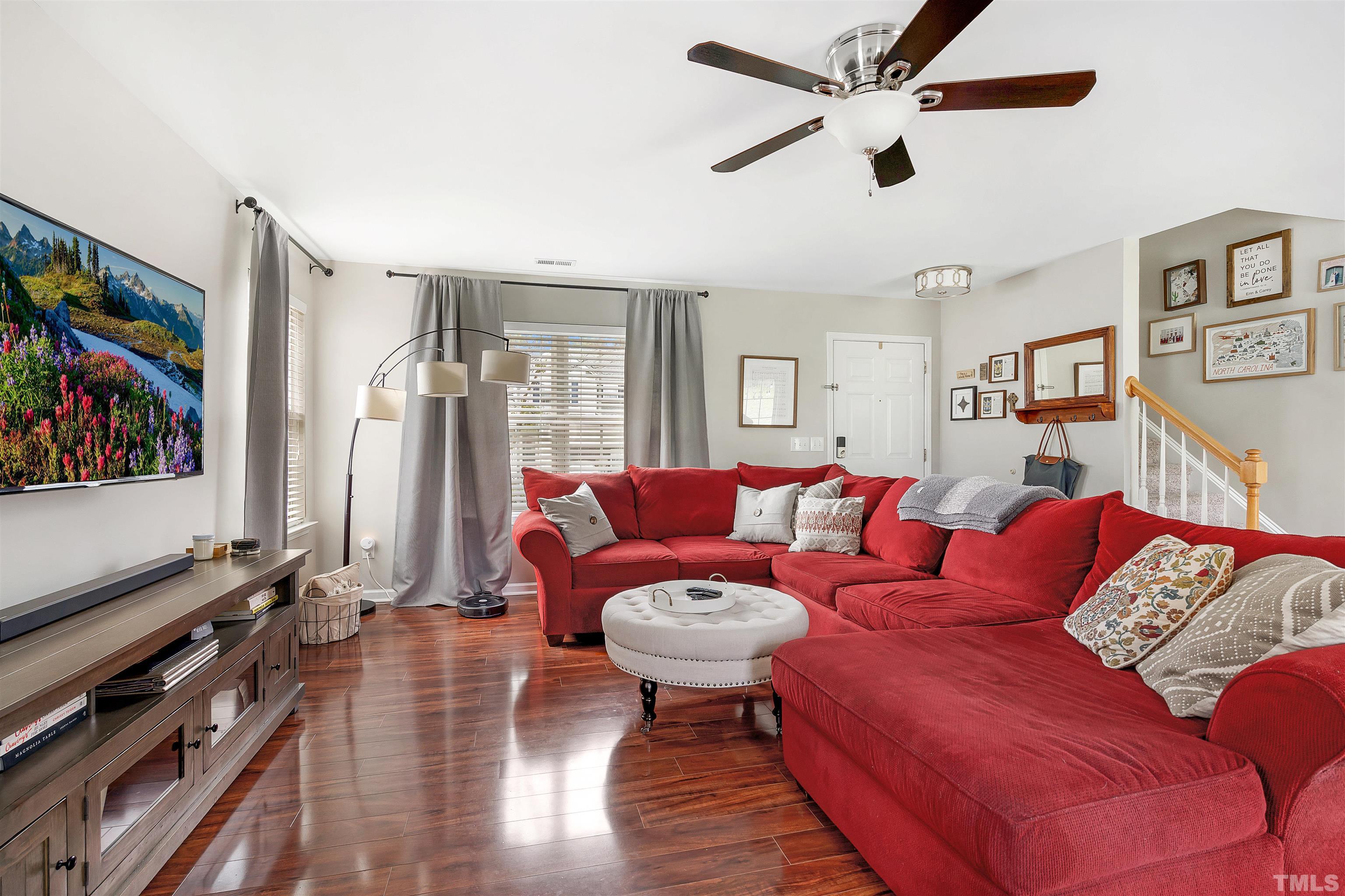 12440 North Exeter Way Durham, NC 27703 - Photo 7 of 36 a living room with furniture and a flat screen tv