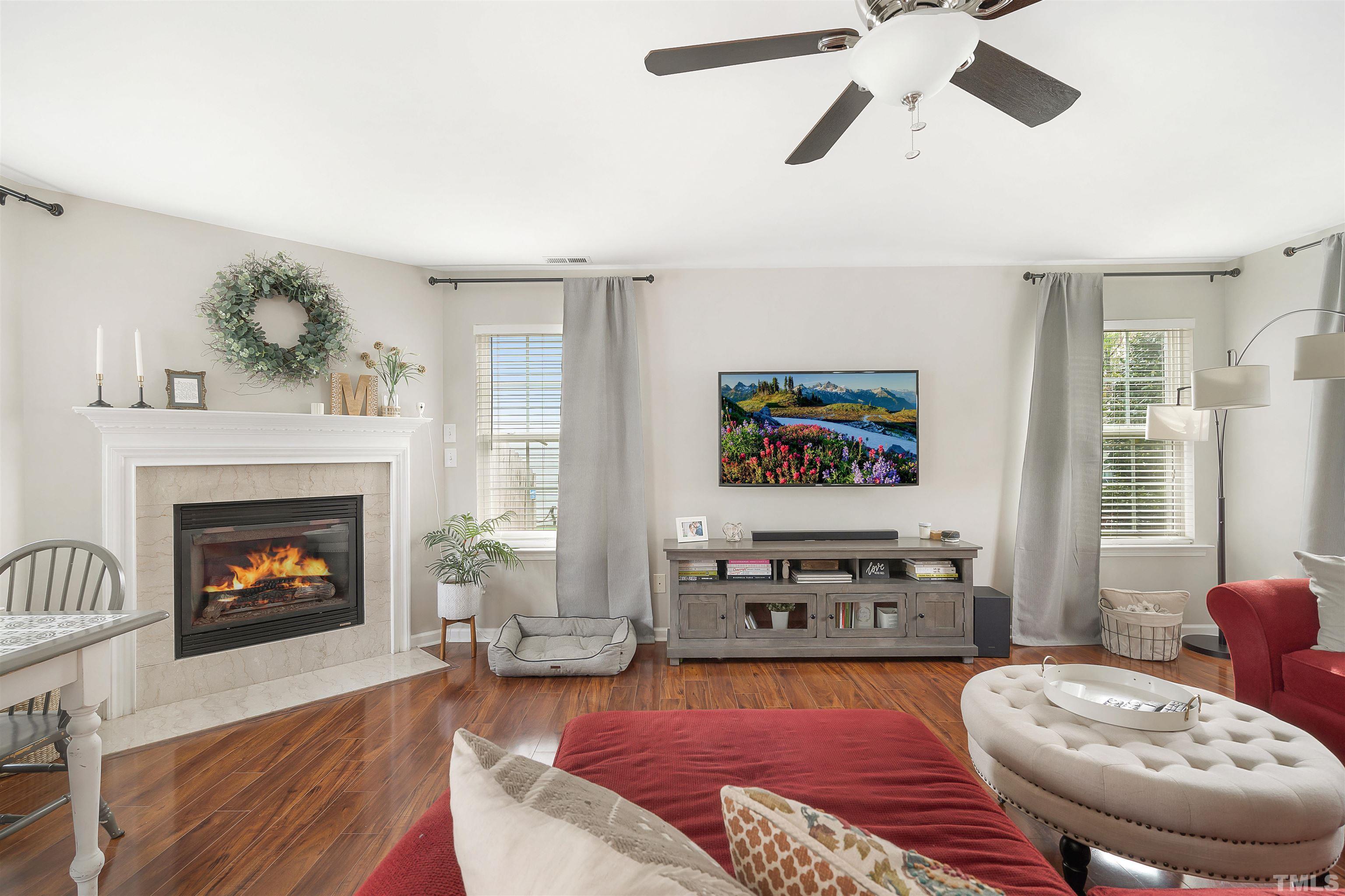 12440 North Exeter Way Durham, NC 27703 - Photo 8 of 36 a living room with furniture and a fireplace