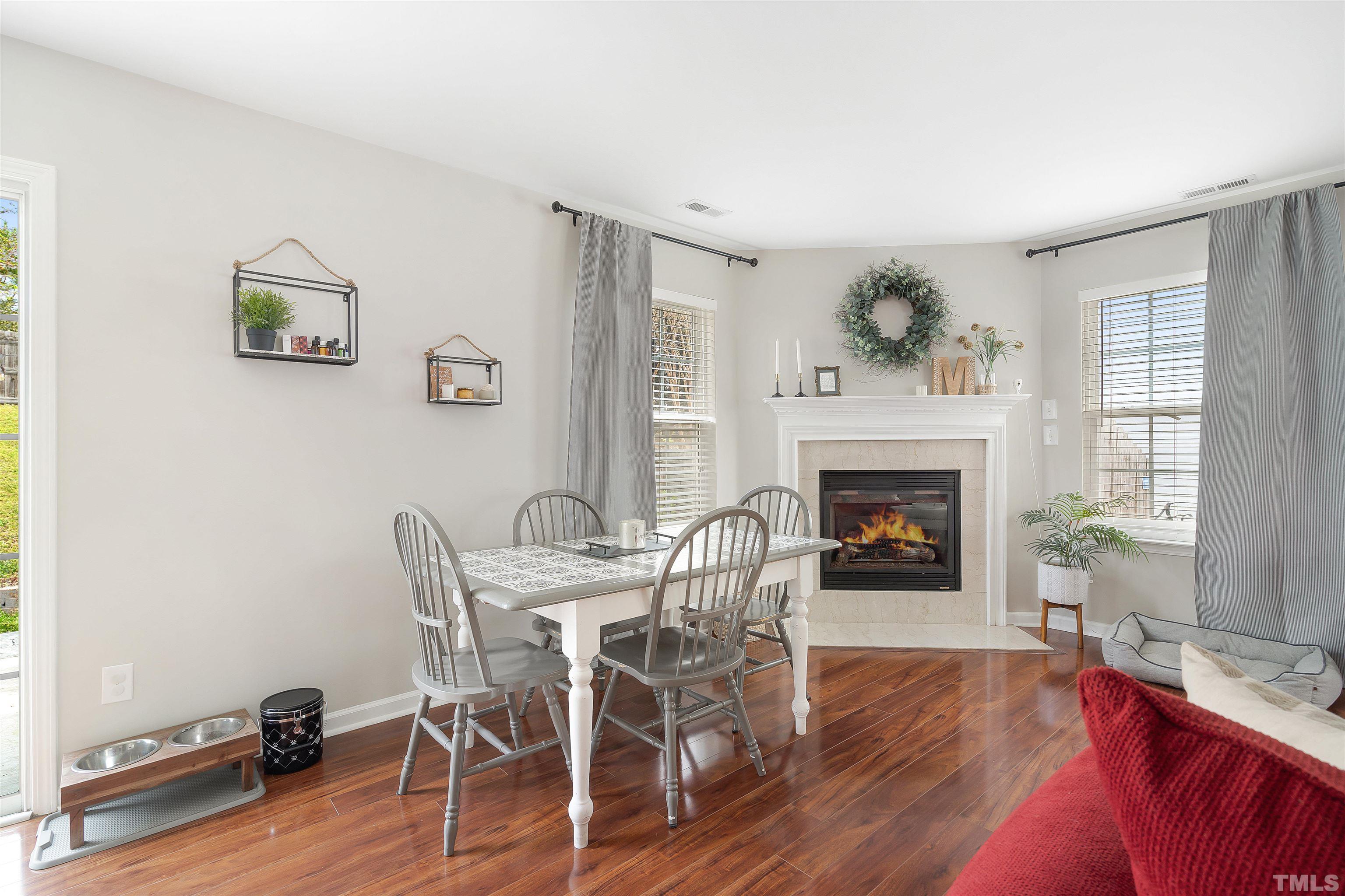 12440 North Exeter Way Durham, NC 27703 - Photo 9 of 36 a view of a livingroom with furniture and a fireplace