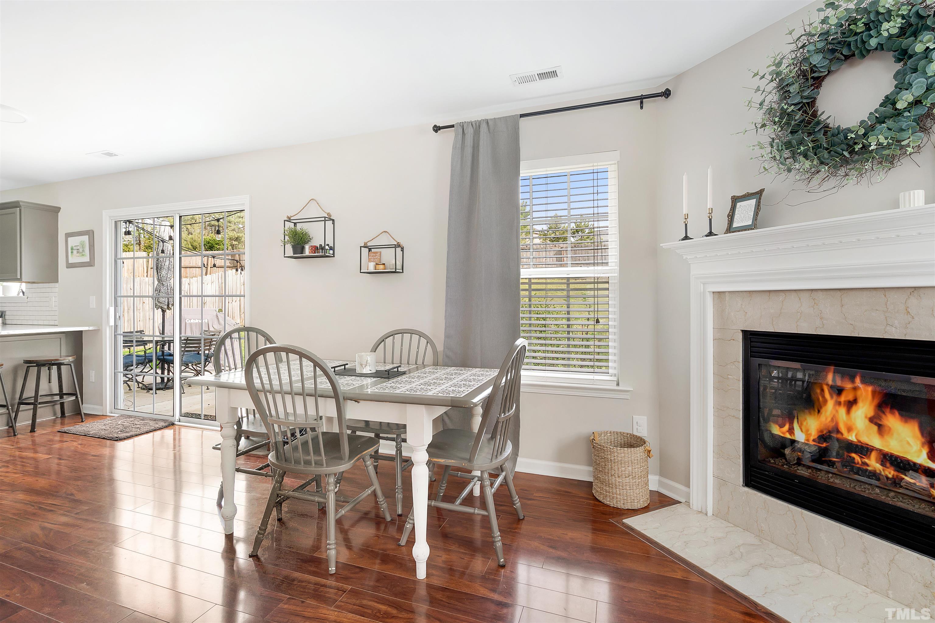 12440 North Exeter Way Durham, NC 27703 - Photo 10 of 36 a view of a livingroom with furniture and a fireplace