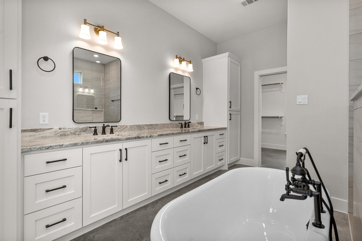 12744 Oak Barrel Road Willis, TX 77378 - Photo 24 of 50 This well-appointed primary bath delivers the perfect blend of elegance, space, and everyday practicality.