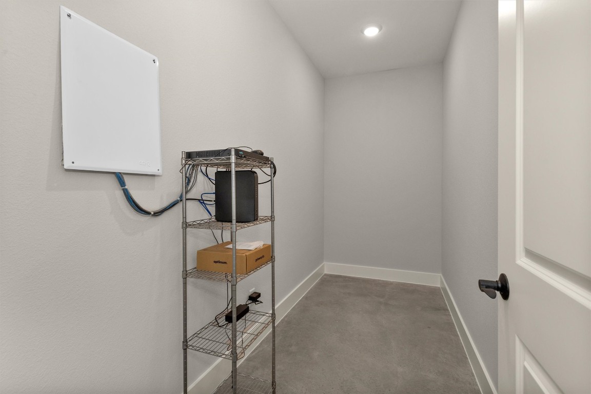 12744 Oak Barrel Road Willis, TX 77378 - Photo 31 of 50 This versatile interior storage room offers a true blank canvas to fit your needs. Whether used to house your central WiFi hub, security system components, safes, seasonal décor, or additional household storage, the space provides flexibility and convenience.
Located within the home for easy access, this multi-function room keeps essential systems and valuables organized and secure while maintaining a clean, uncluttered living environment. A practical bonus space ready to adapt to your lifestyle.