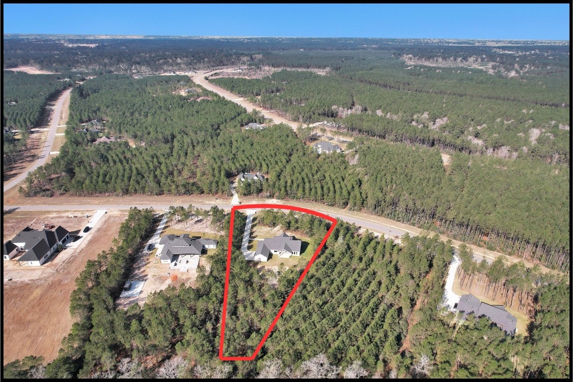 12744 Oak Barrel Road Willis, TX 77378 - Photo 44 of 50 Perfectly situated on the lot, the home is thoughtfully positioned to maximize both curb appeal and backyard space. With plenty of room to add a pool, workshop, garden, or simply enjoy wide-open views, this expansive property delivers the ideal balance of comfort, flexibility, and tranquility.