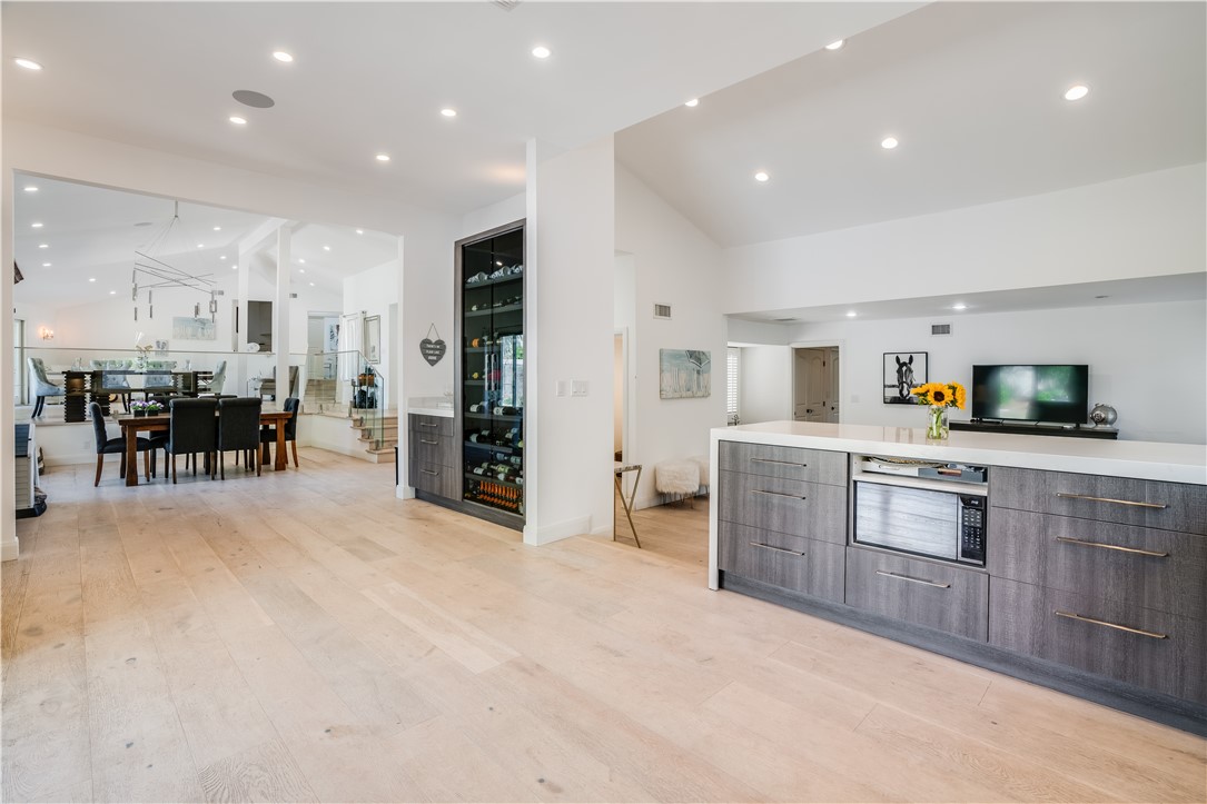 23760 Oakfield Road Hidden Hills, CA 91302 - Photo 1 of 23 a open kitchen with lots of counter space dining table and stainless steel appliances