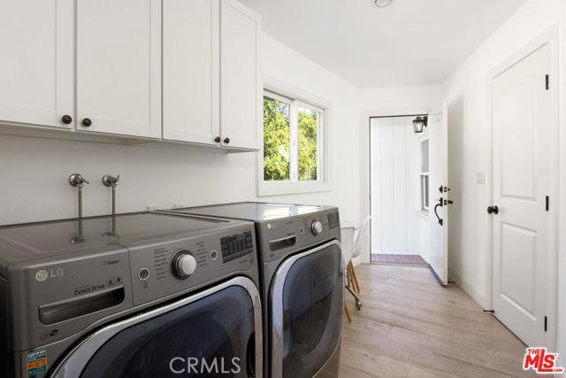 23760 Oakfield Road Hidden Hills, CA 91302 - Photo 11 of 23 a utility room with dryer and washer