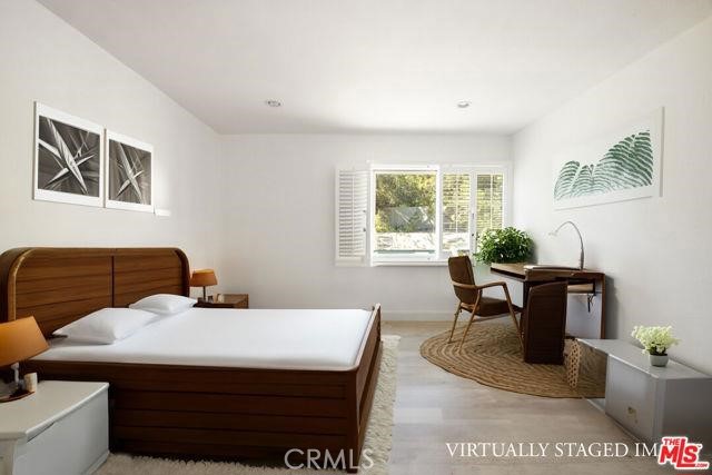 23760 Oakfield Road Hidden Hills, CA 91302 - Photo 12 of 23 a living room with furniture and a potted plant