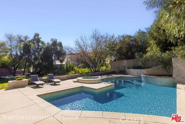 23760 Oakfield Road Hidden Hills, CA 91302 - Photo 16 of 23 a view of a patio with chairs and plants