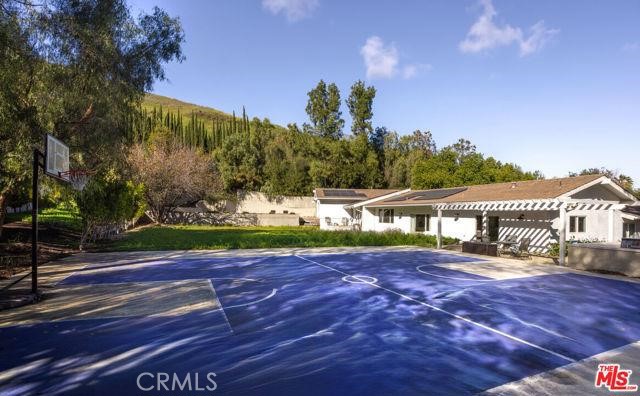 23760 Oakfield Road Hidden Hills, CA 91302 - Photo 20 of 23 a view of a house with a yard