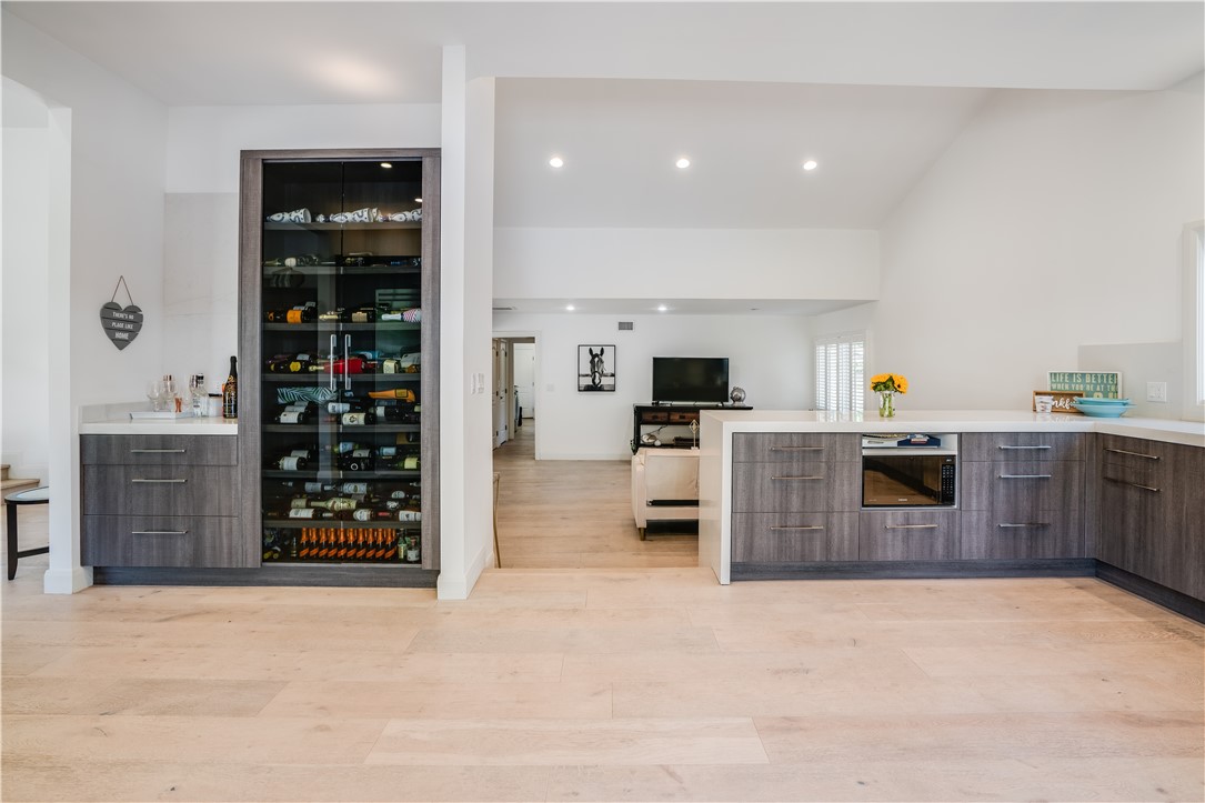 23760 Oakfield Road Hidden Hills, CA 91302 - Photo 2 of 23 a kitchen with stainless steel appliances a refrigerator and a stove top oven