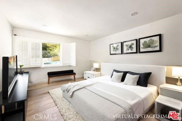 23760 Oakfield Road Hidden Hills, CA 91302 - Photo 23 of 23 a bedroom with a bed and wooden floor
