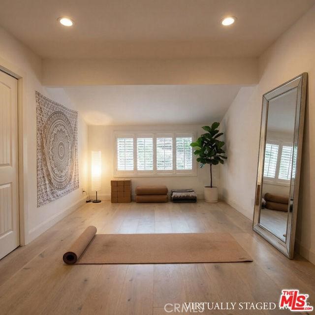 23760 Oakfield Road Hidden Hills, CA 91302 - Photo 9 of 23 a living room with furniture and a potted plant