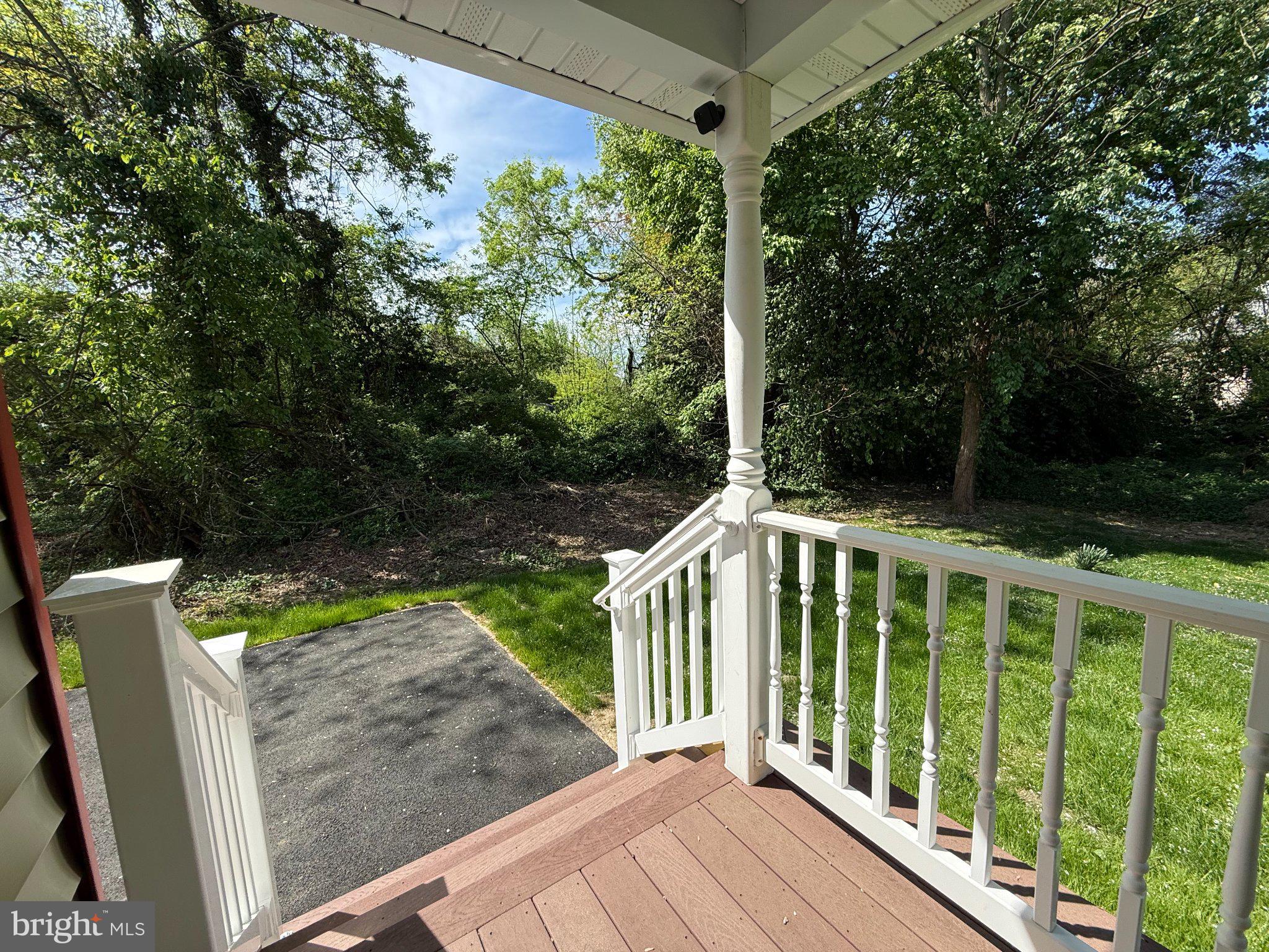 6416 Edesville Road Rock Hall, MD 21661 - Photo 41 of 43 Serene porch view of lush greenery.