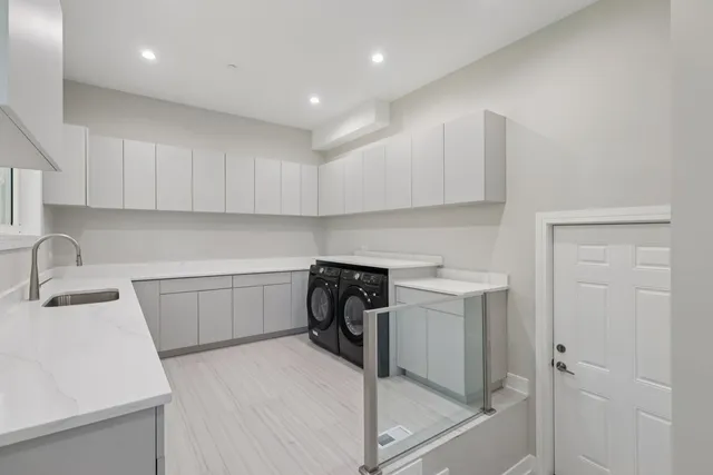 a bathroom with a double vanity sink mirror double and shower