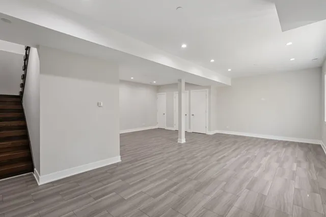a bathroom with a sink mirror toilet and shower
