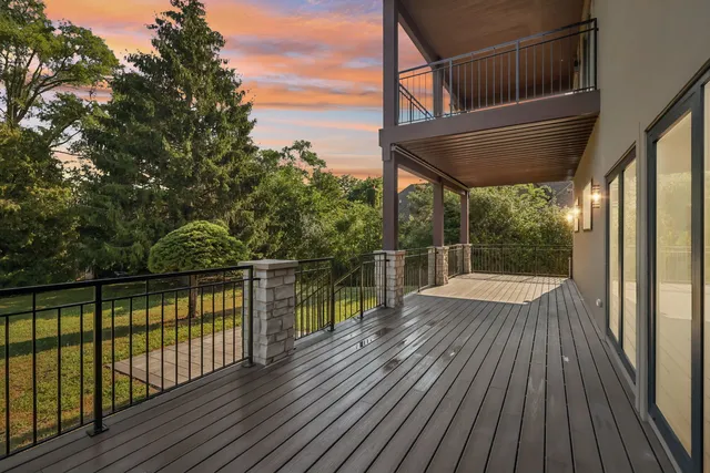 a view of balcony with wooden floor and outdoor seating