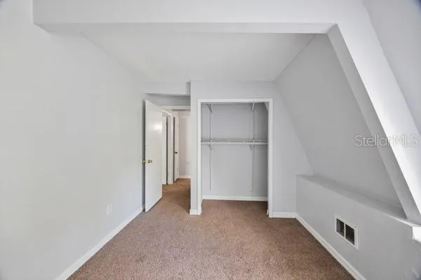 a white toilet sitting next to a bath tub