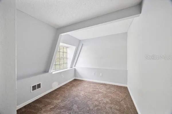 a bathroom with a sink vanity granite and a mirror