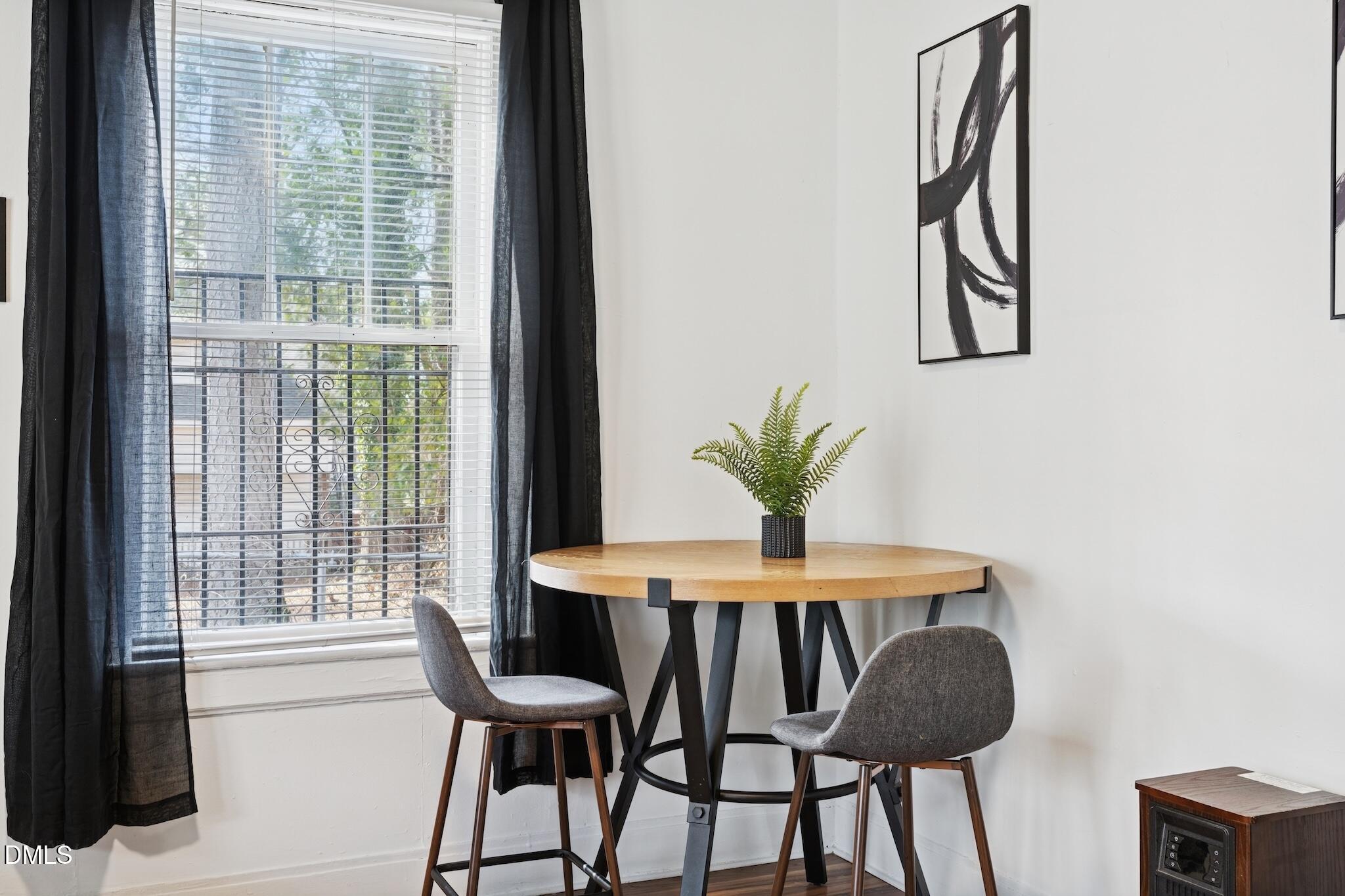 705 North Driver Street Durham, NC 27703 - Photo 32 of 46 a dining room with furniture and window