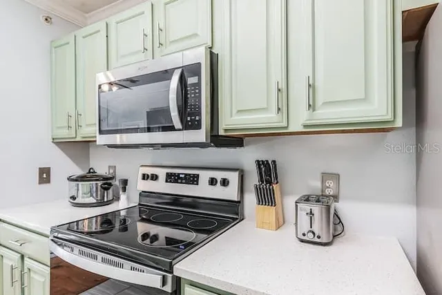 a kitchen with a stove and cabinets