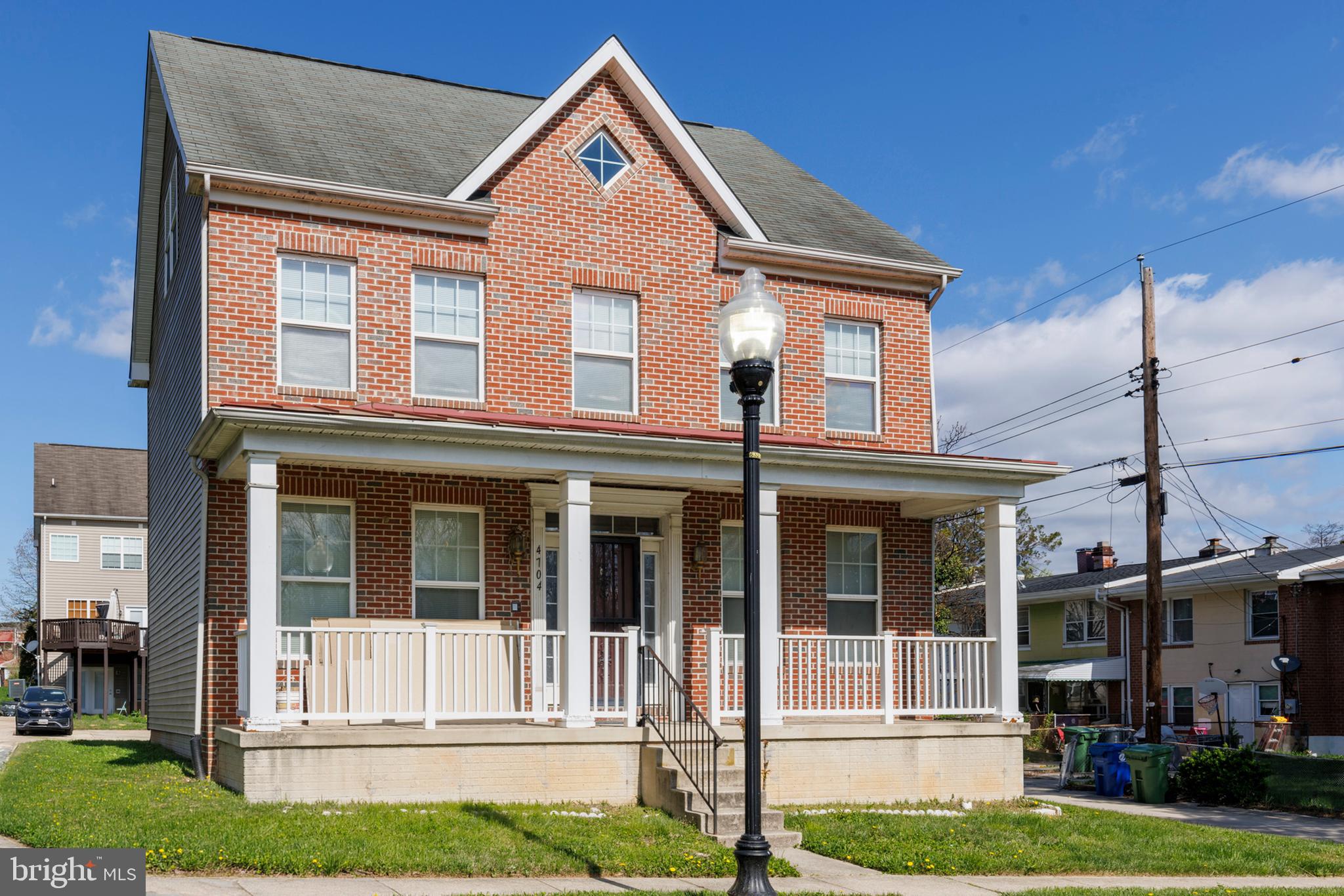 4704 Denview Way Baltimore, MD 21206 - Photo 2 of 42 a front view of a house with a yard