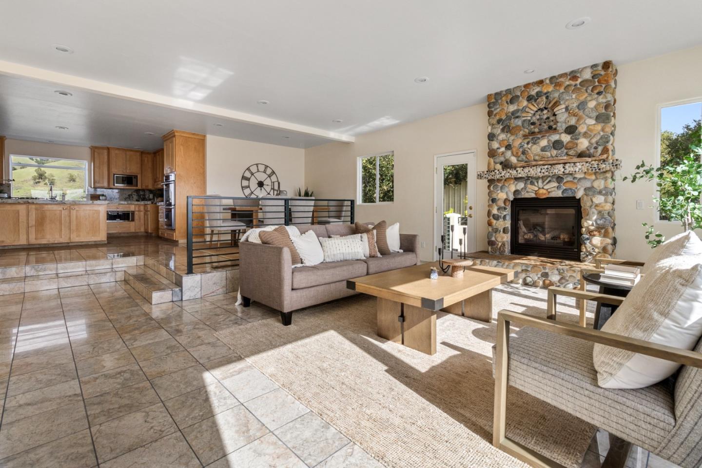 320 El Caminito Road Carmel Valley, CA 93924 - Photo 15 of 62 a living room with furniture a fireplace and a table
