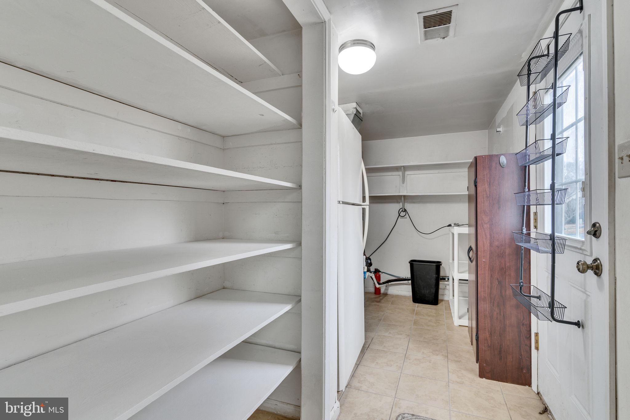 9216 Spring Acres Road Clinton, MD 20735 - Photo 20 of 36 Storage room (pantry) off w/ access to backyard