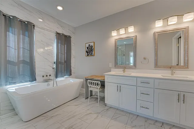 a bathroom with a shower and a tub