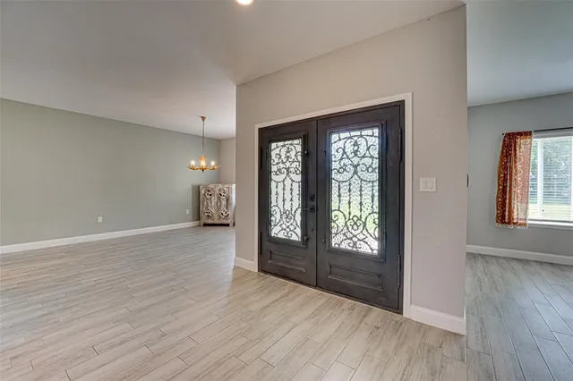 a view of an entryway with wooden floor