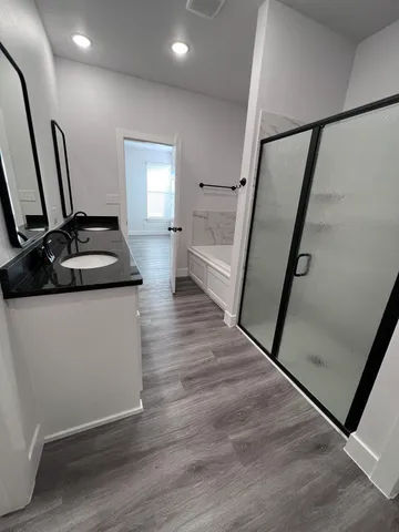 a kitchen with sink and mirror