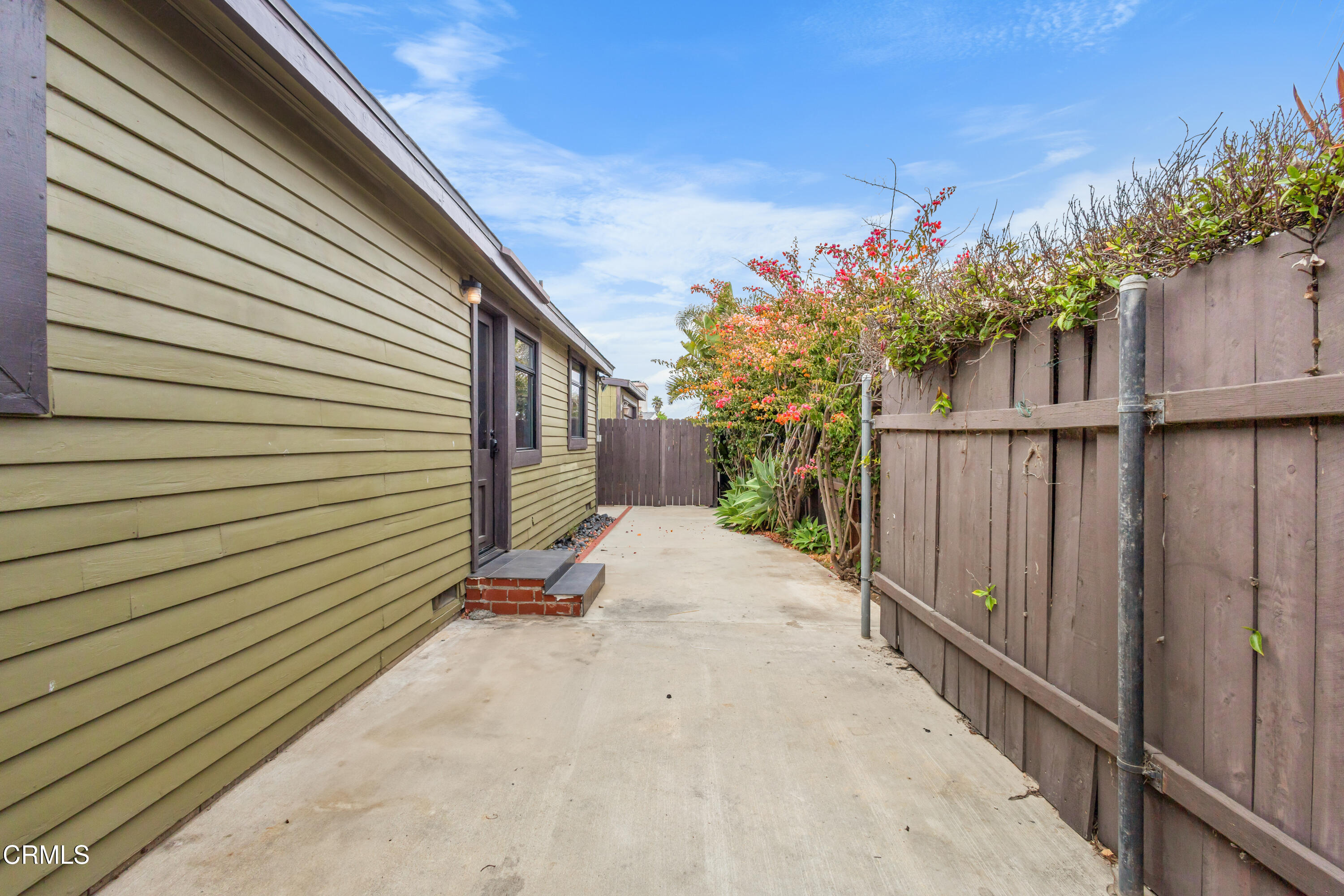 153 San Fernando Avenue Oxnard, CA 93035 - Photo 3 of 22 a view of a backyard with pathway