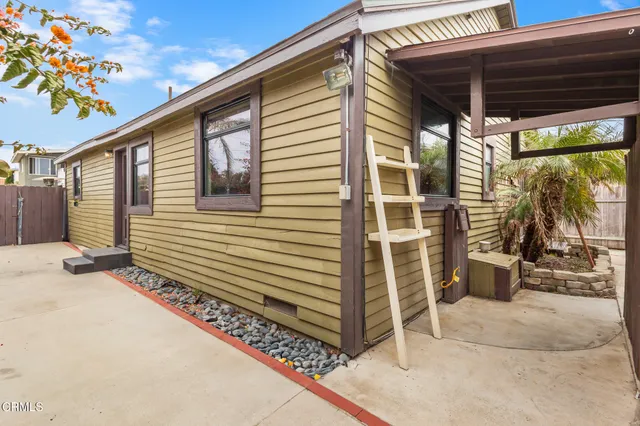 a yellow house with a outdoor view