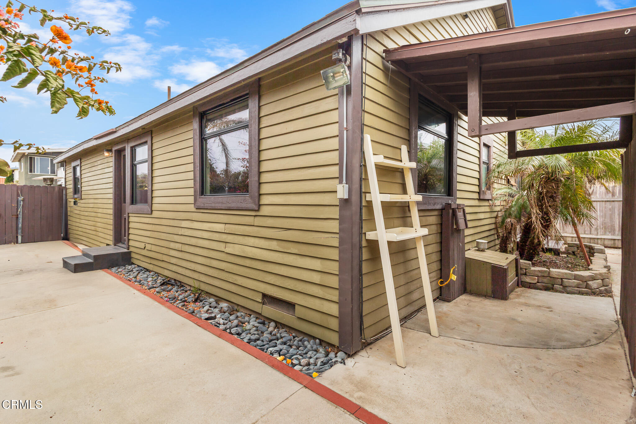 153 San Fernando Avenue Oxnard, CA 93035 - Photo 5 of 22 a yellow house with a outdoor view