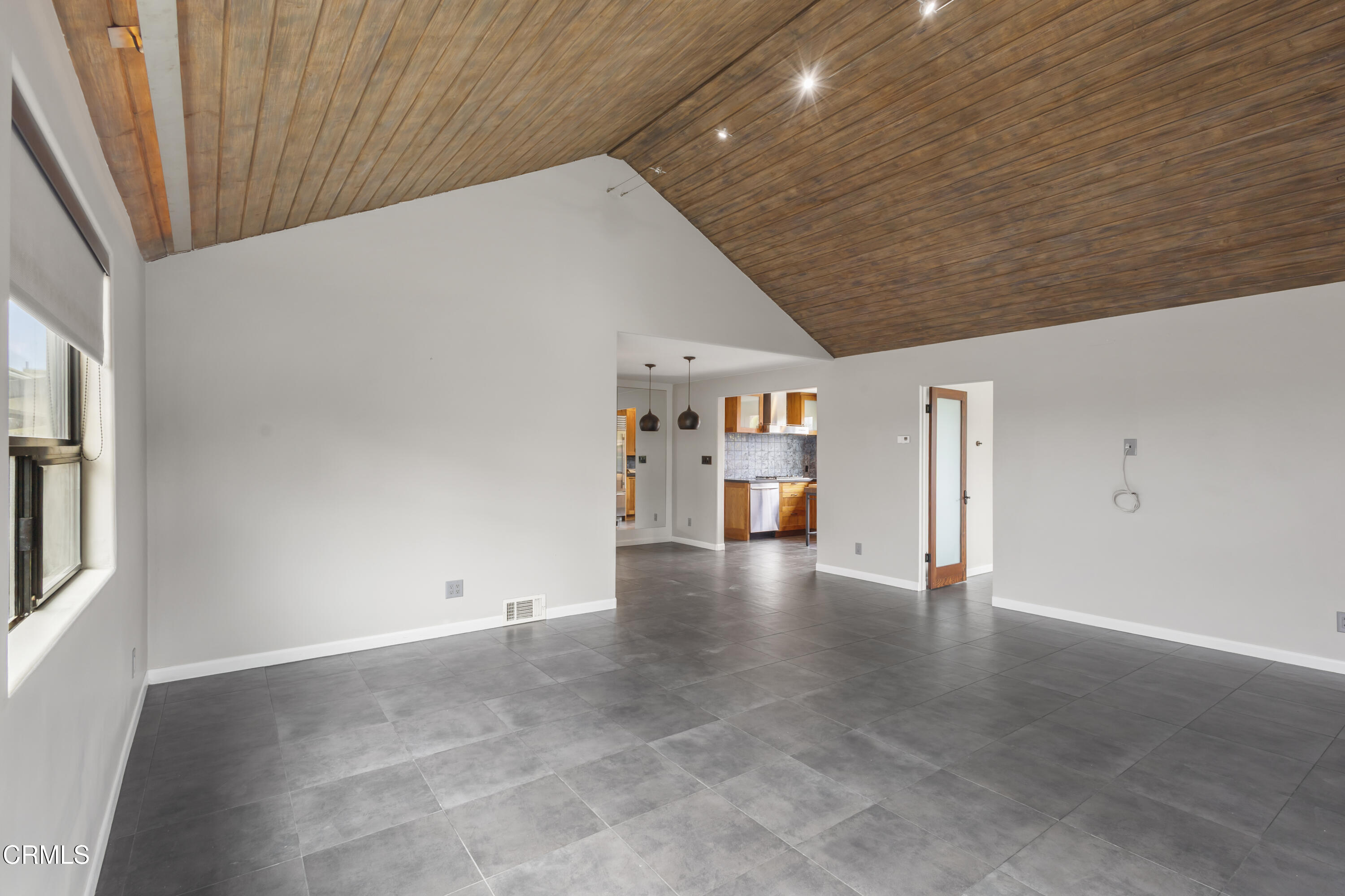 153 San Fernando Avenue Oxnard, CA 93035 - Photo 8 of 22 wooden floor in an empty room with a window