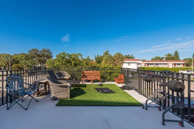 a balcony with furniture and city view