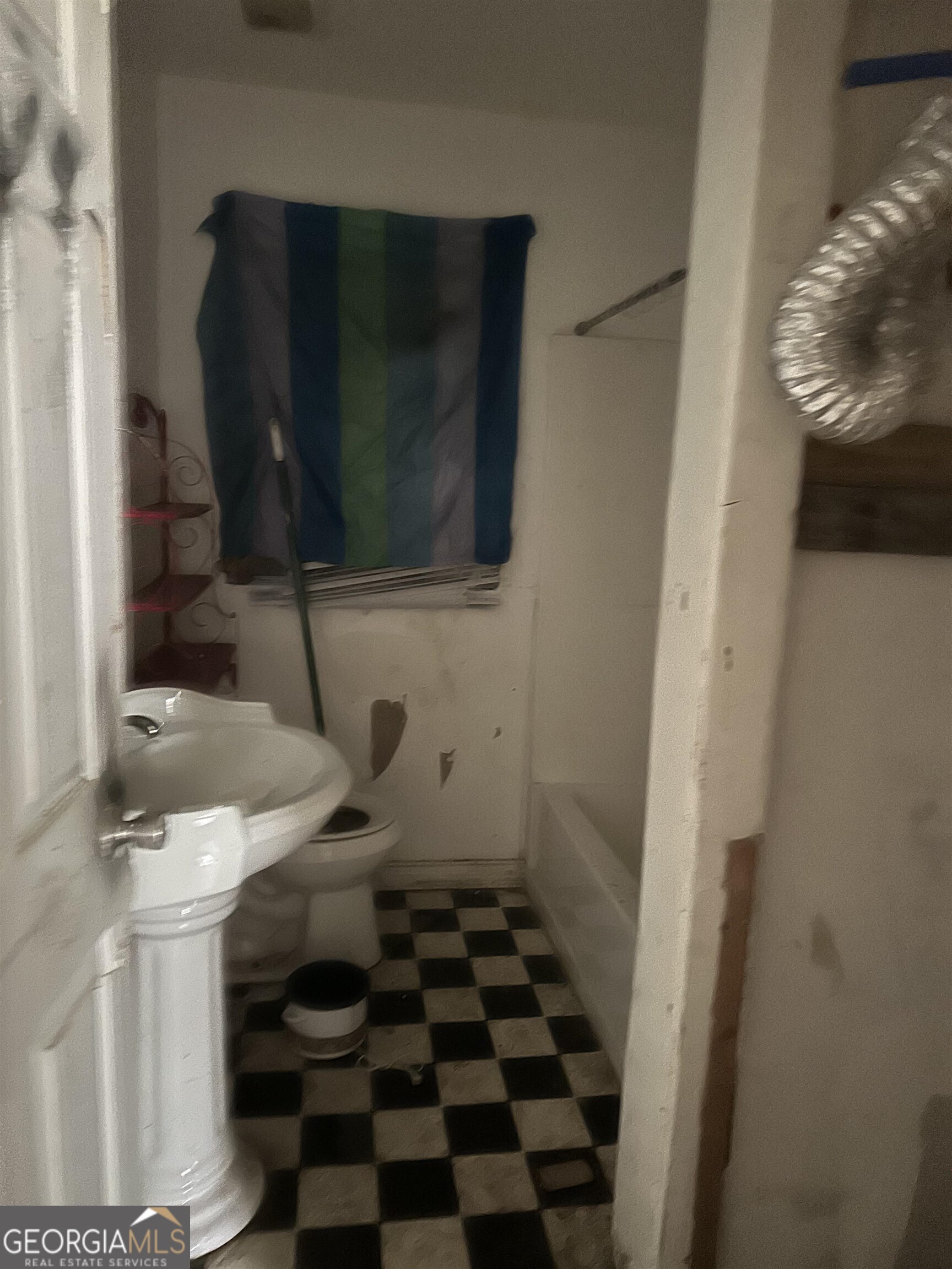 2960 Jadan Place Macon, GA 31206 - Photo 8 of 9 a bathroom with a sink and a mirror