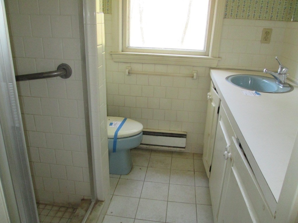 66 Westcott Road Harvard, MA 01451 - Photo 19 of 38 a bathroom with a sink a toilet and a mirror