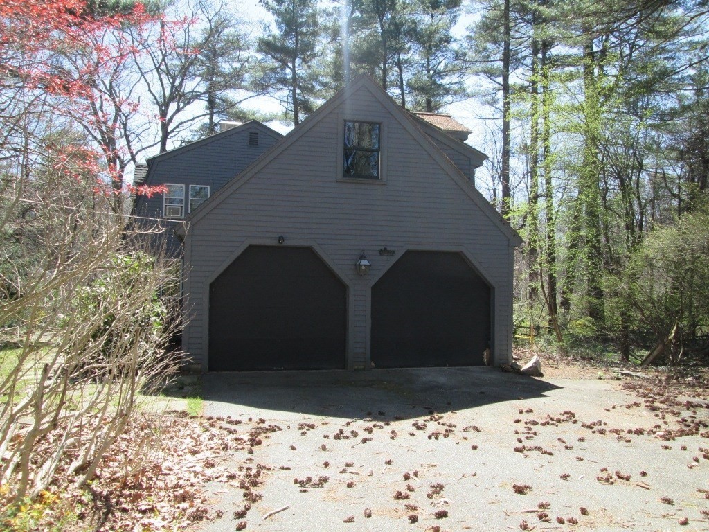 66 Westcott Road Harvard, MA 01451 - Photo 2 of 38 a front view of a house with a yard