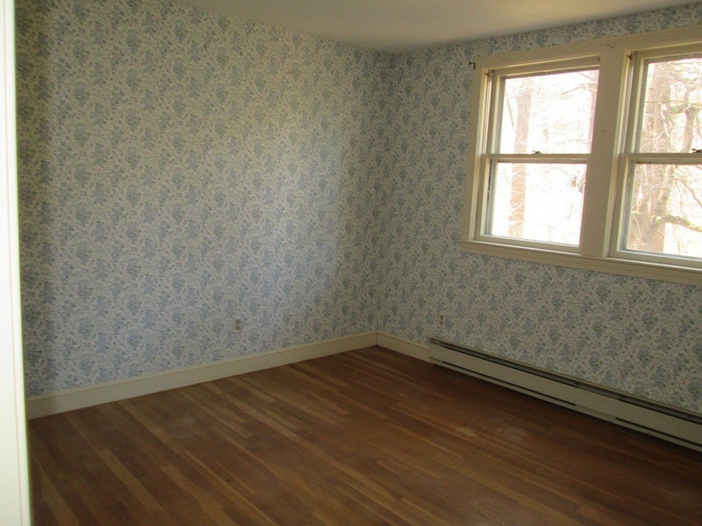 66 Westcott Road Harvard, MA 01451 - Photo 22 of 38 a view of a room with wooden floor and small window