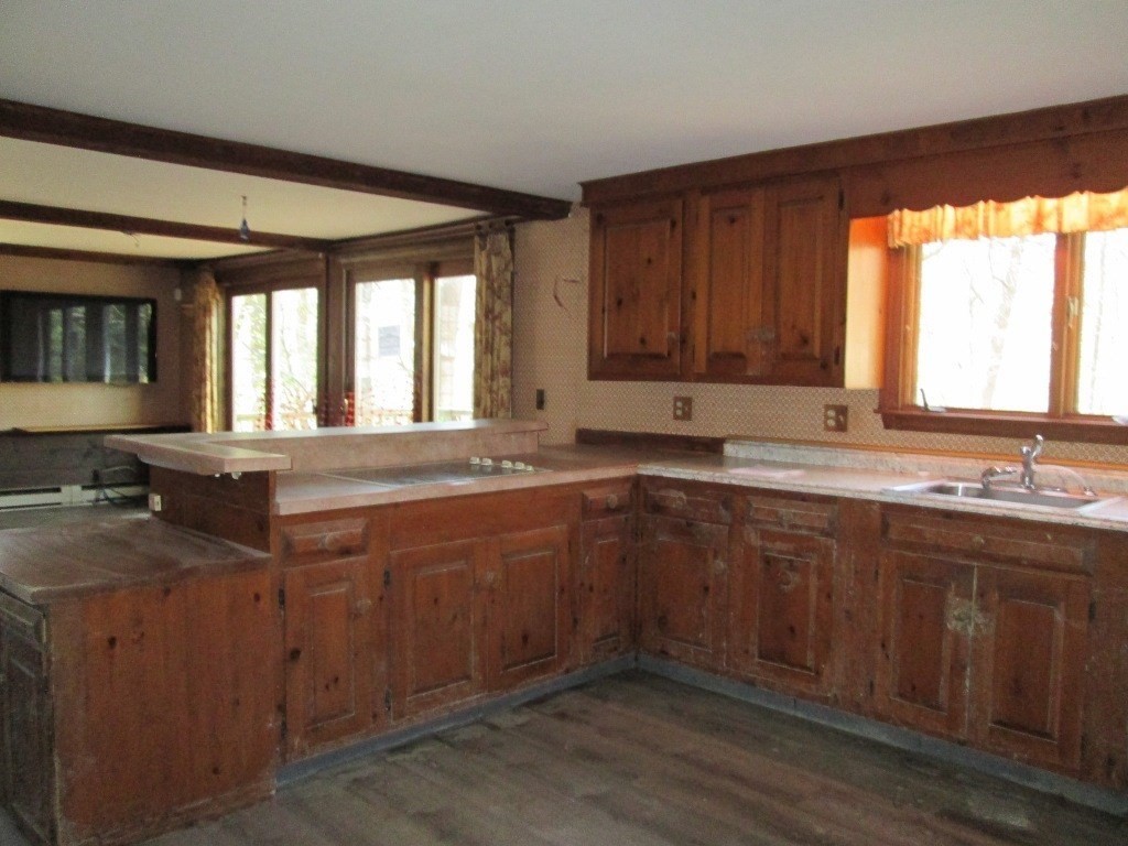 66 Westcott Road Harvard, MA 01451 - Photo 5 of 38 a large kitchen with granite countertop a sink and a window
